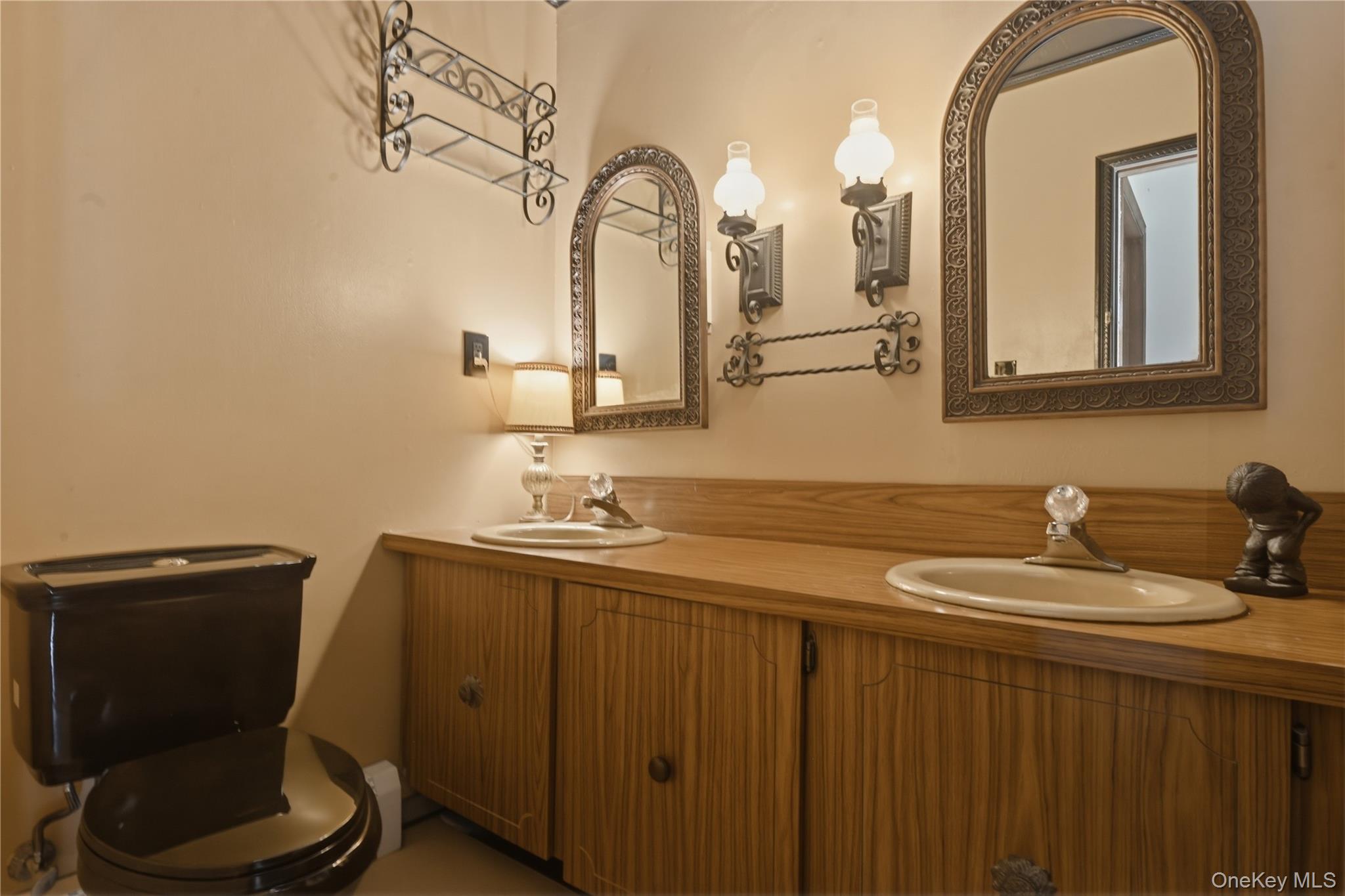 19 Gaymor Lane Commack, NY 11725 - Photo 19 of 25 a bathroom with a granite countertop toilet sink and mirror