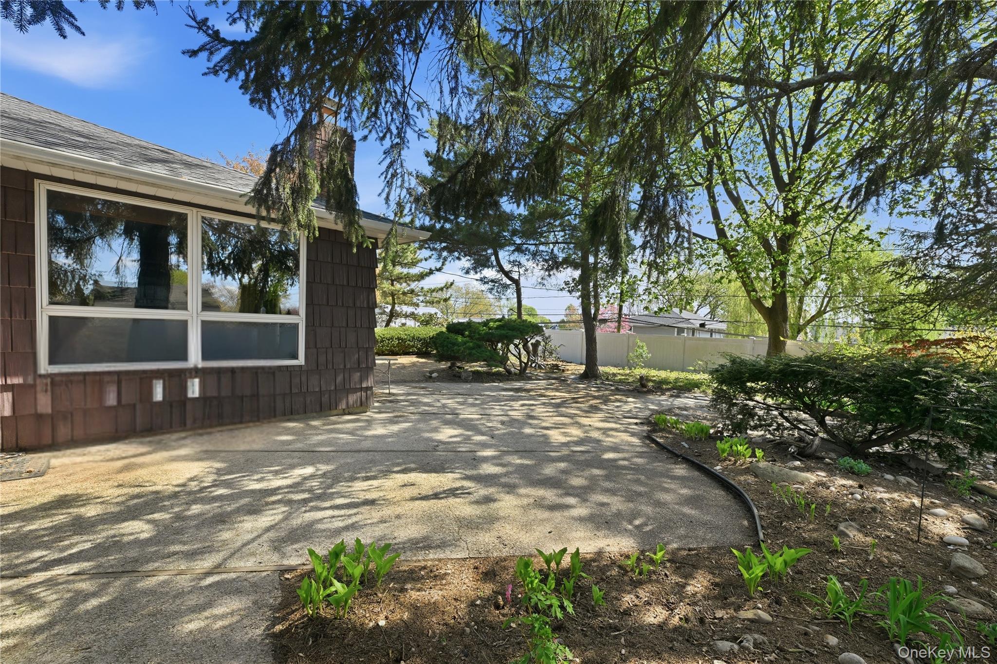 19 Gaymor Lane Commack, NY 11725 - Photo 20 of 25 a view of a house with a yard and tree s