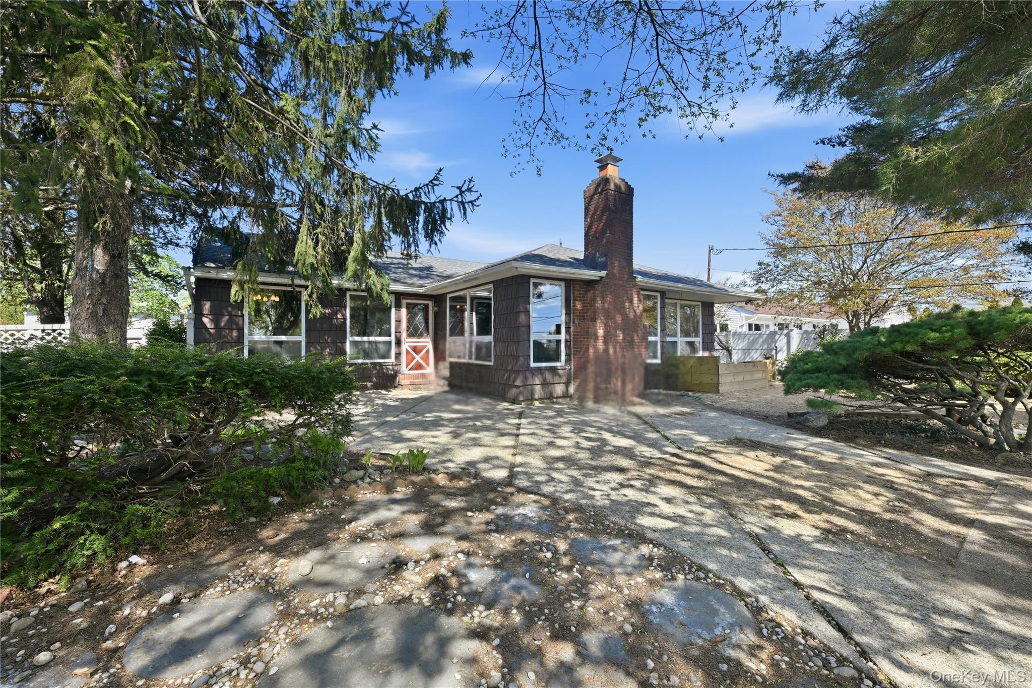 19 Gaymor Lane Commack, NY 11725 - Photo 23 of 25 a front view of a house with a garden