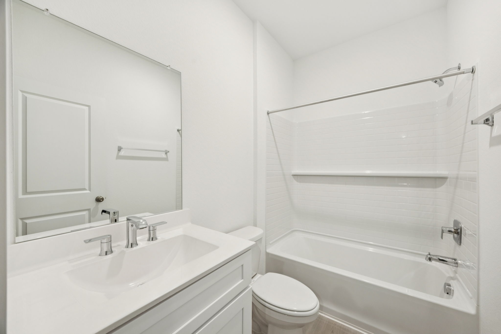 26266 Arrowleaf Drive Magnolia, TX 77355 - Photo 23 of 30 a bathroom with a bathtub shower sink vanity and toilet