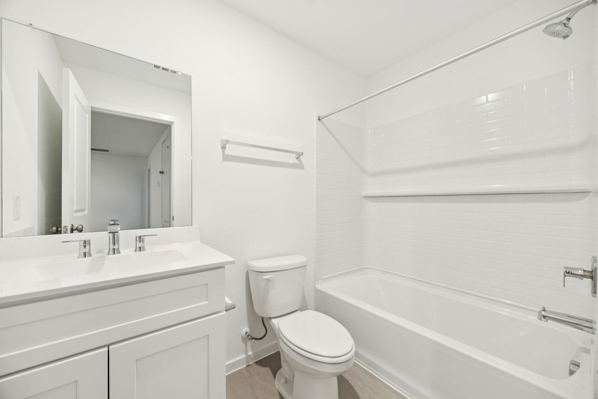 26266 Arrowleaf Drive Magnolia, TX 77355 - Photo 24 of 30 a bathroom with a toilet a sink and a bathtub