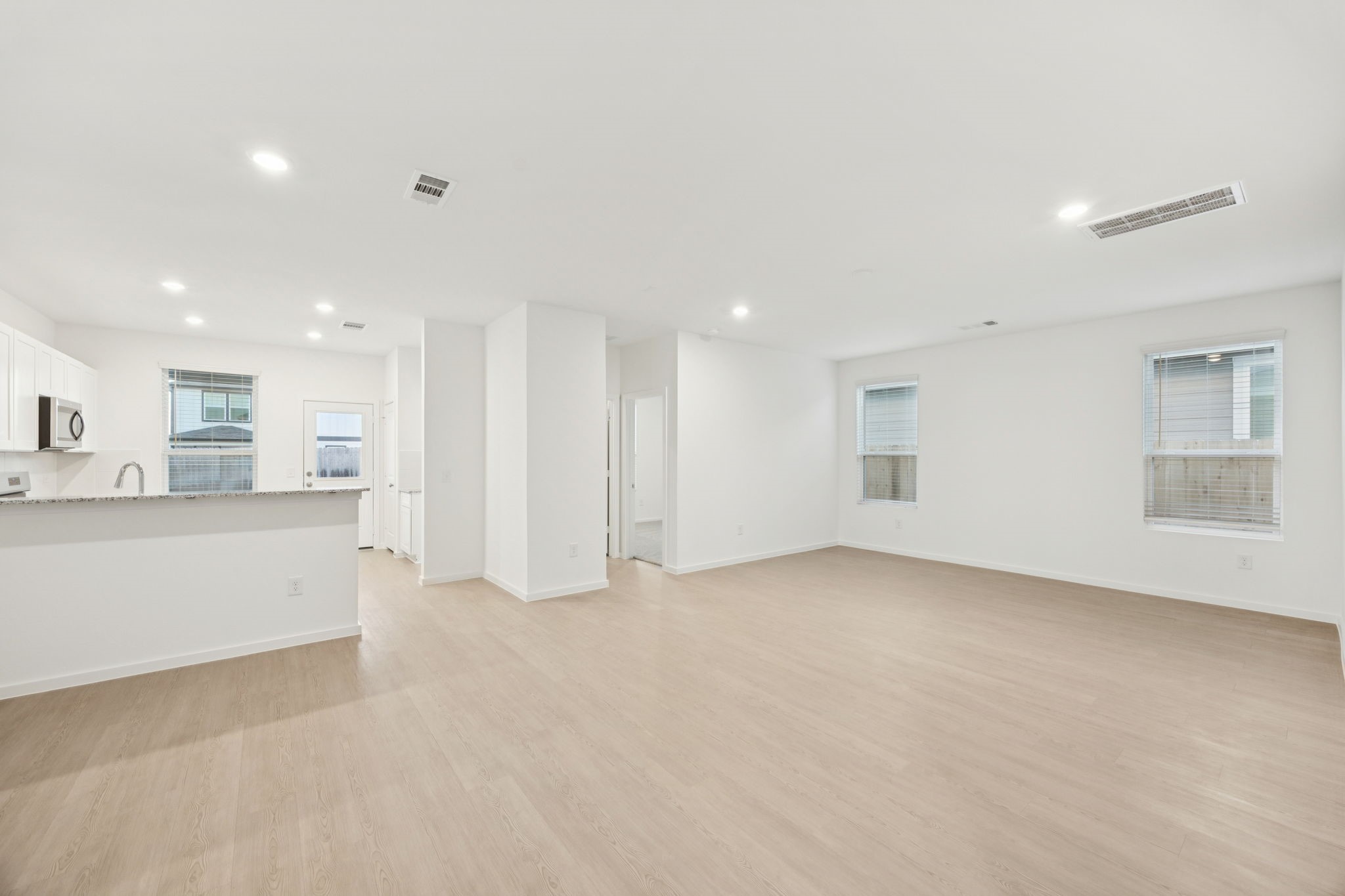 26266 Arrowleaf Drive Magnolia, TX 77355 - Photo 4 of 30 a view of an empty room with a kitchen