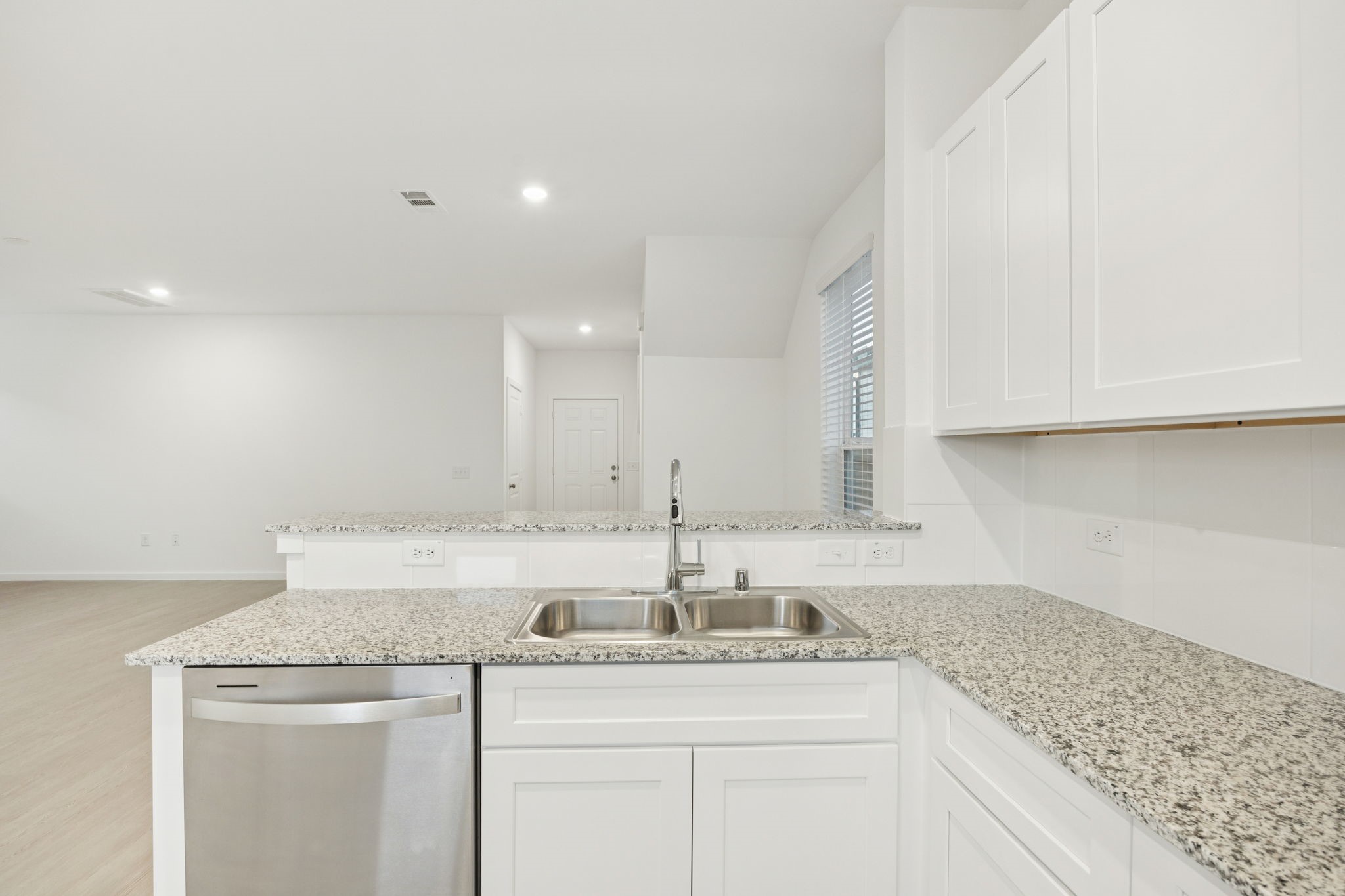 26266 Arrowleaf Drive Magnolia, TX 77355 - Photo 6 of 30 a kitchen with stainless steel appliances granite countertop a sink a stove and cabinets