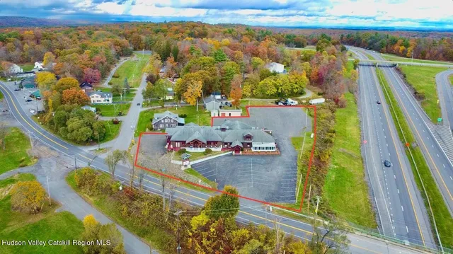 an aerial view of residential houses with outdoor space