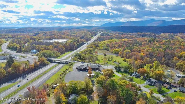 a dining room with lots of furniture and a chandelier