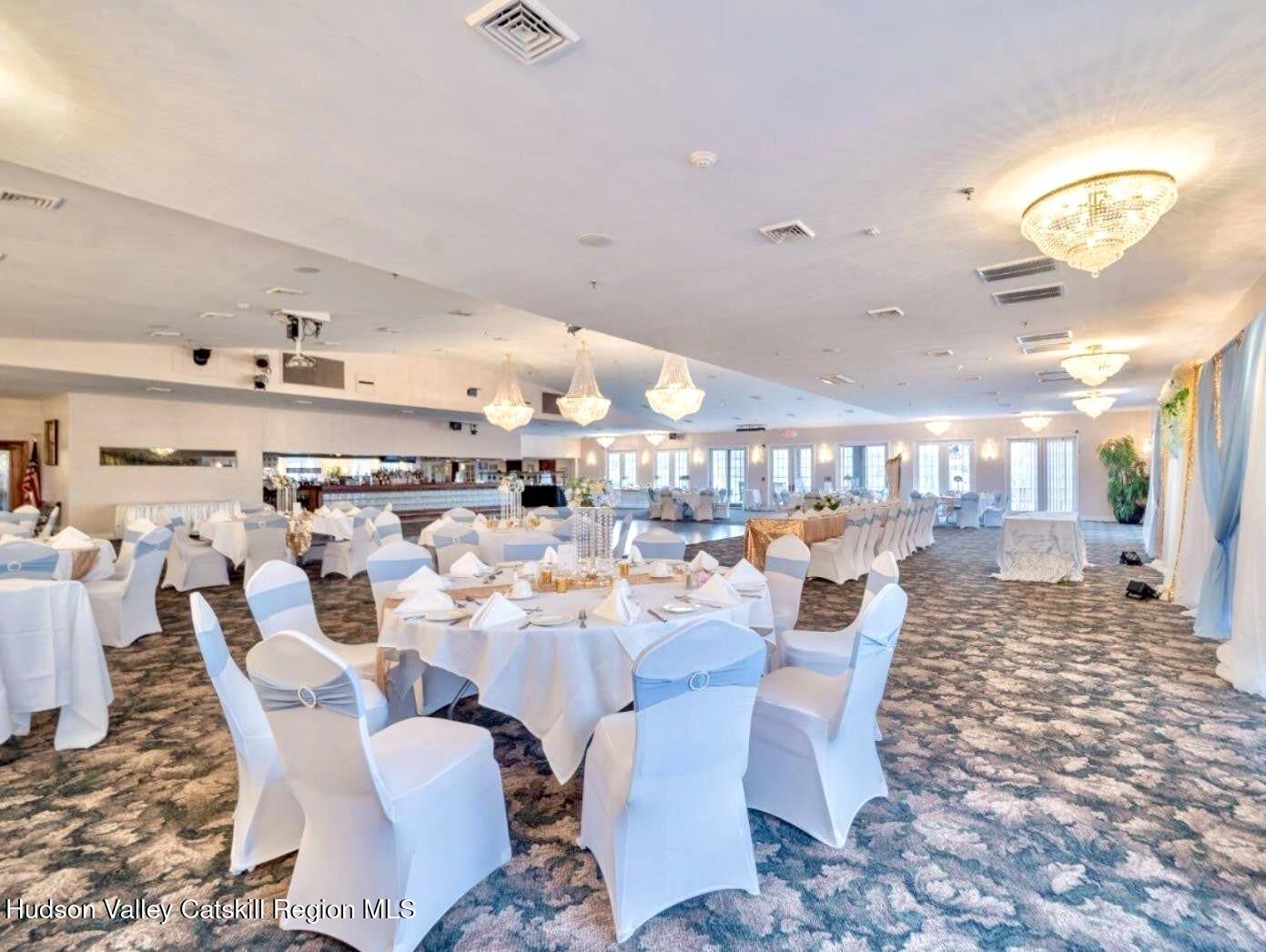 746 County Road 23B Catskill, NY 12451 - Photo 22 of 50 a dining room with lots of furniture and a chandelier