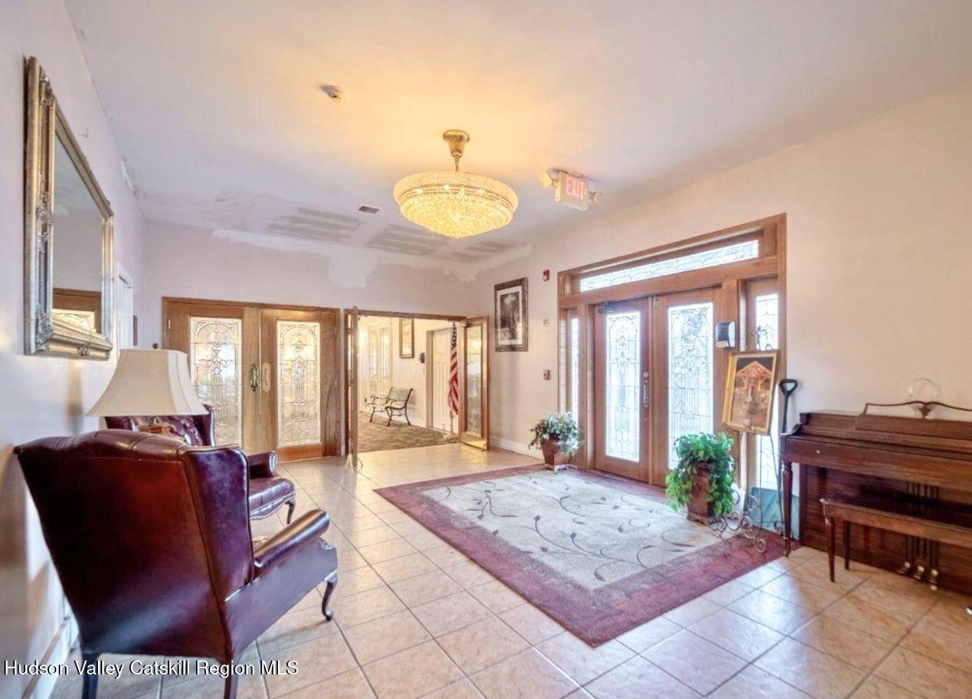746 County Road 23B Catskill, NY 12451 - Photo 26 of 50 a living room with furniture and a floor to ceiling window