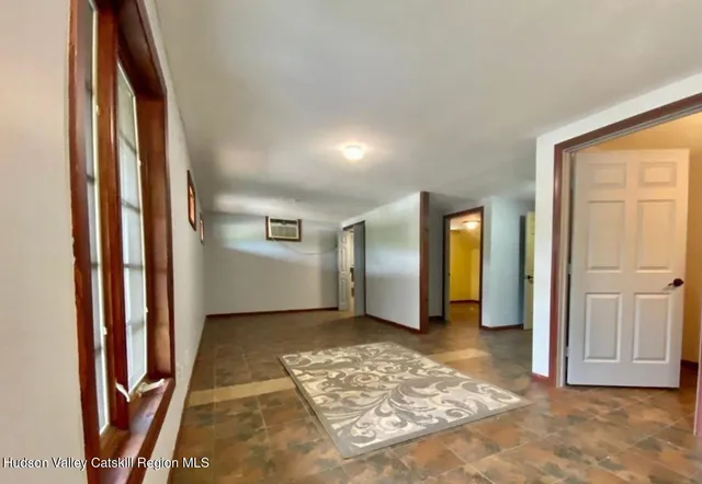 a living room with furniture pool table and a couch