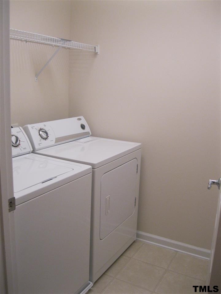 8608 Redcrest Place Raleigh, NC 27617 - Photo 15 of 17 Walk-in laundry with washer and dryer.