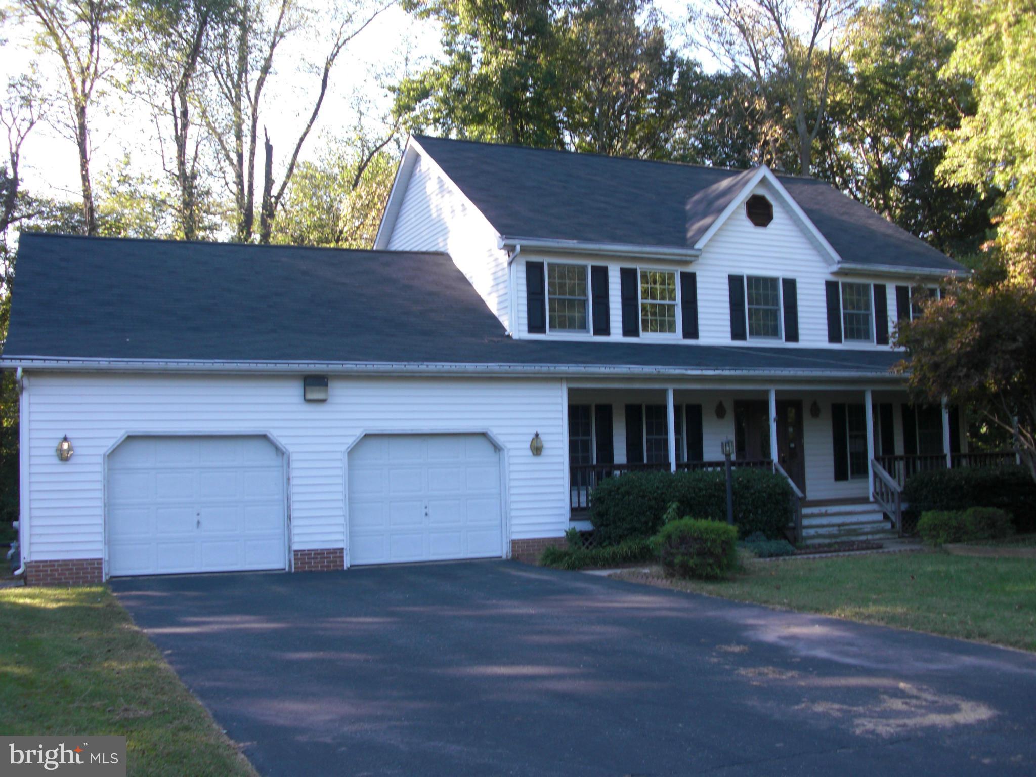616 Westgate Road Aberdeen, MD 21001 - Photo 1 of 11 a front view of a house with a yard and garage