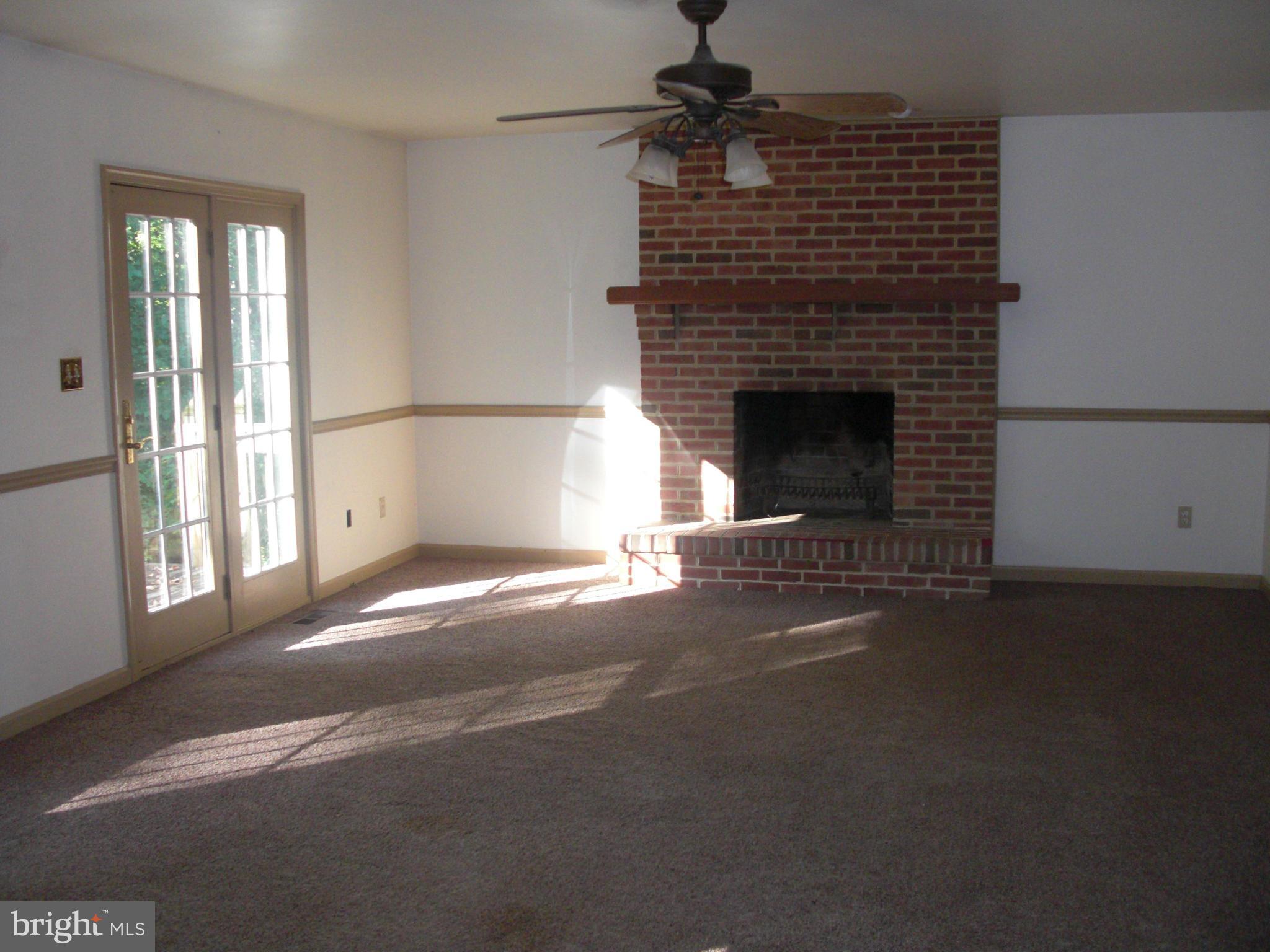 616 Westgate Road Aberdeen, MD 21001 - Photo 6 of 11 a view of empty room with a fireplace