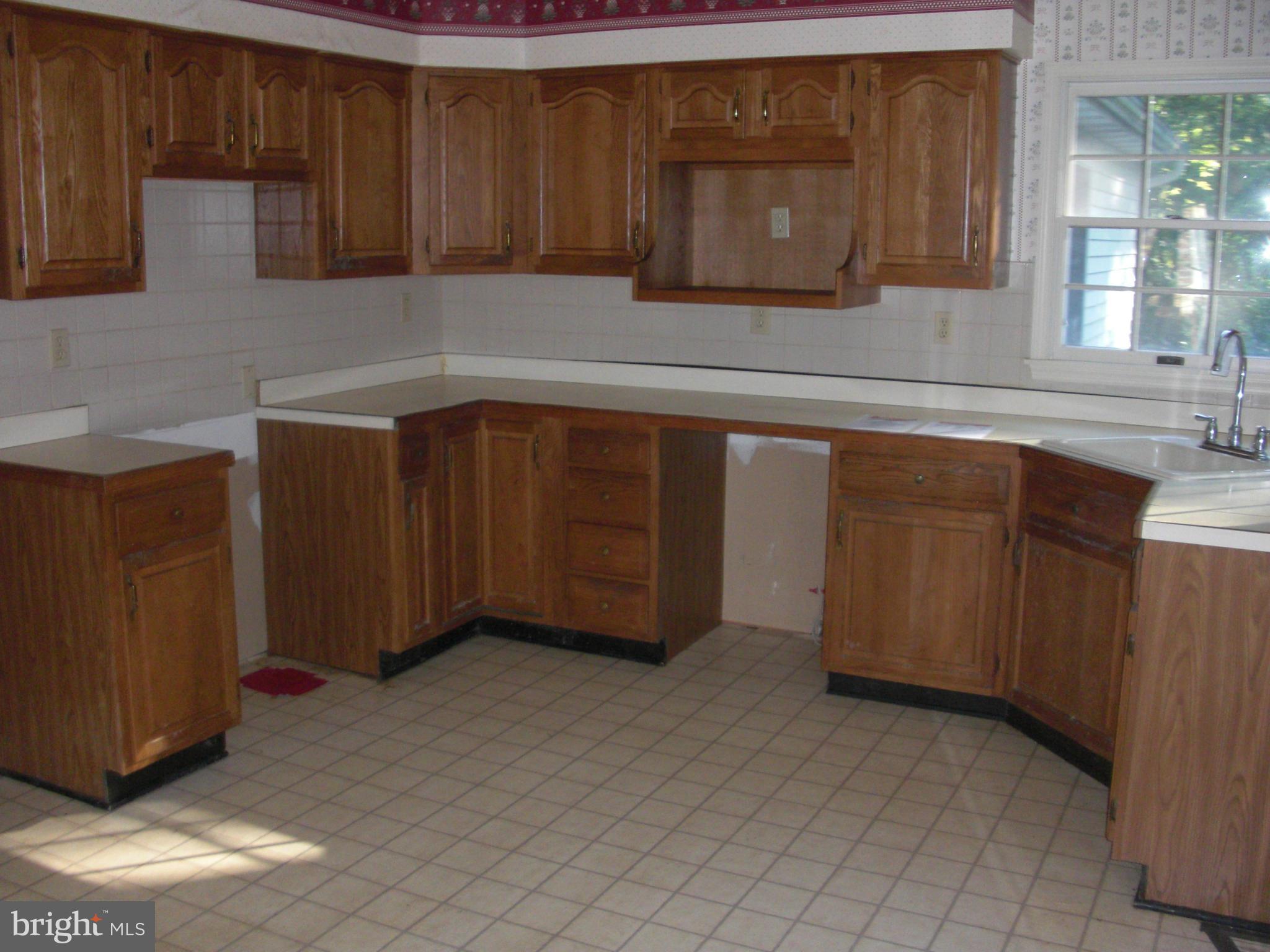 616 Westgate Road Aberdeen, MD 21001 - Photo 7 of 11 a kitchen with a sink and cabinets
