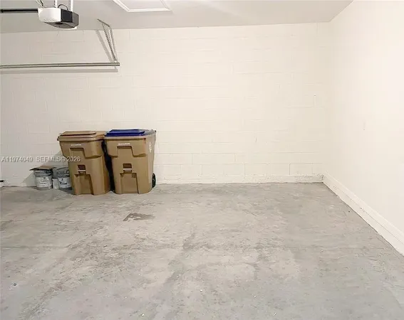 a view of a refrigerator in kitchen and utility room