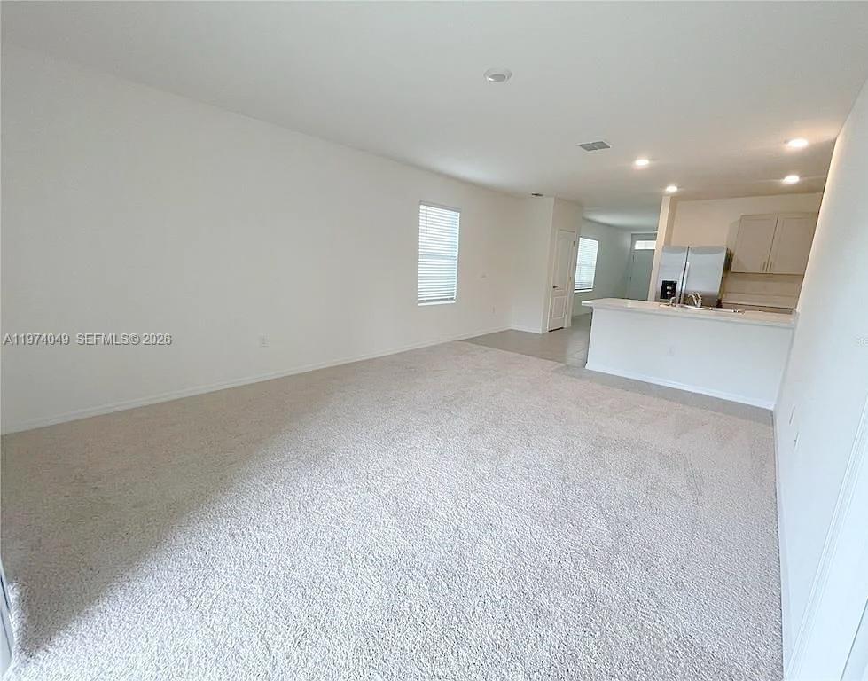 1556 Gladewater Road, Unit 1556 Kissimmee, FL 34744 - Photo 12 of 26 a view of empty room with kitchen