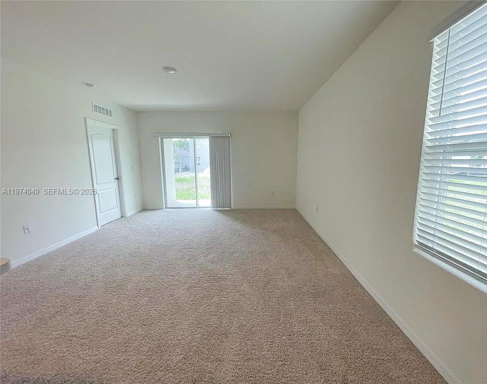 1556 Gladewater Road, Unit 1556 Kissimmee, FL 34744 - Photo 14 of 26 a view of empty room with window