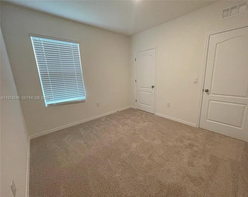 1556 Gladewater Road, Unit 1556 Kissimmee, FL 34744 - Photo 19 of 26 a view of an empty room with a window