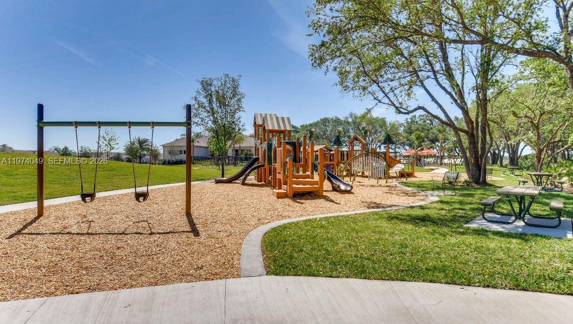 1556 Gladewater Road, Unit 1556 Kissimmee, FL 34744 - Photo 26 of 26 a view of a park with swings