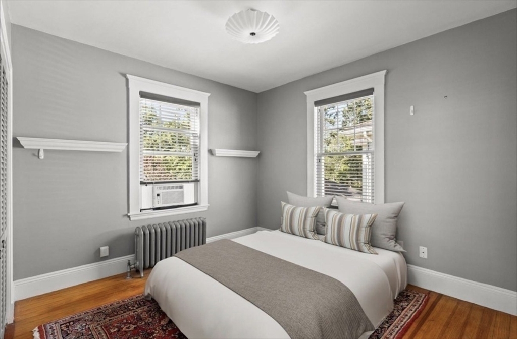 15 Belvoir Road, Unit 2 Milton, MA 02186 - Photo 12 of 13 a bedroom with a bed and a window