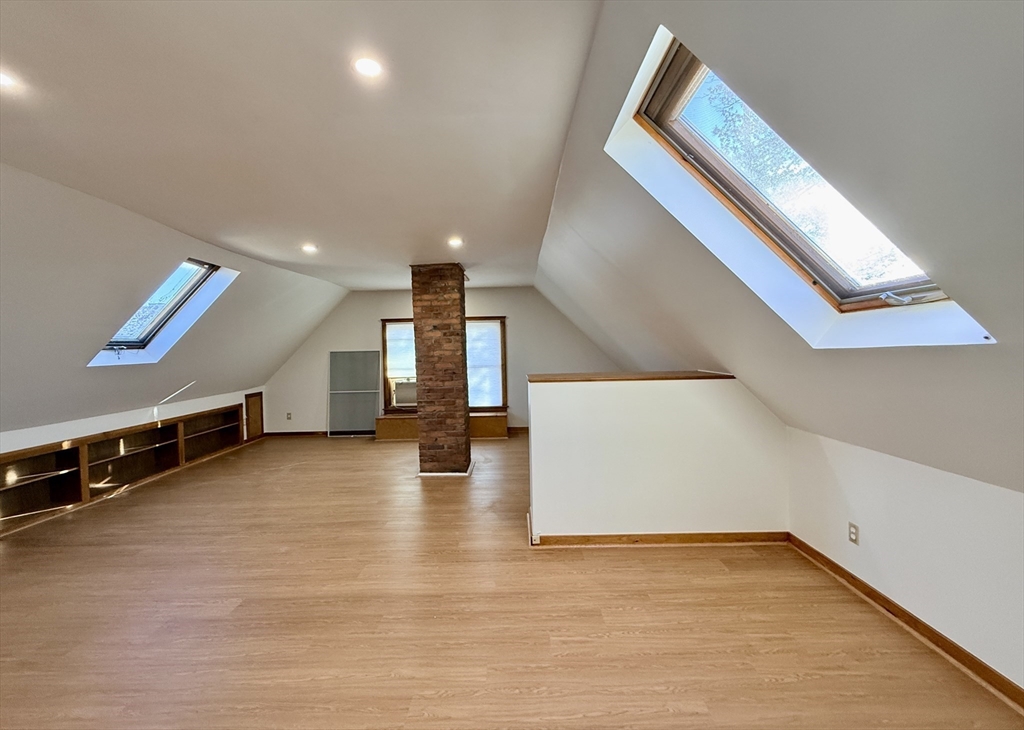 15 Belvoir Road, Unit 2 Milton, MA 02186 - Photo 8 of 13 a view of an empty room with stairs