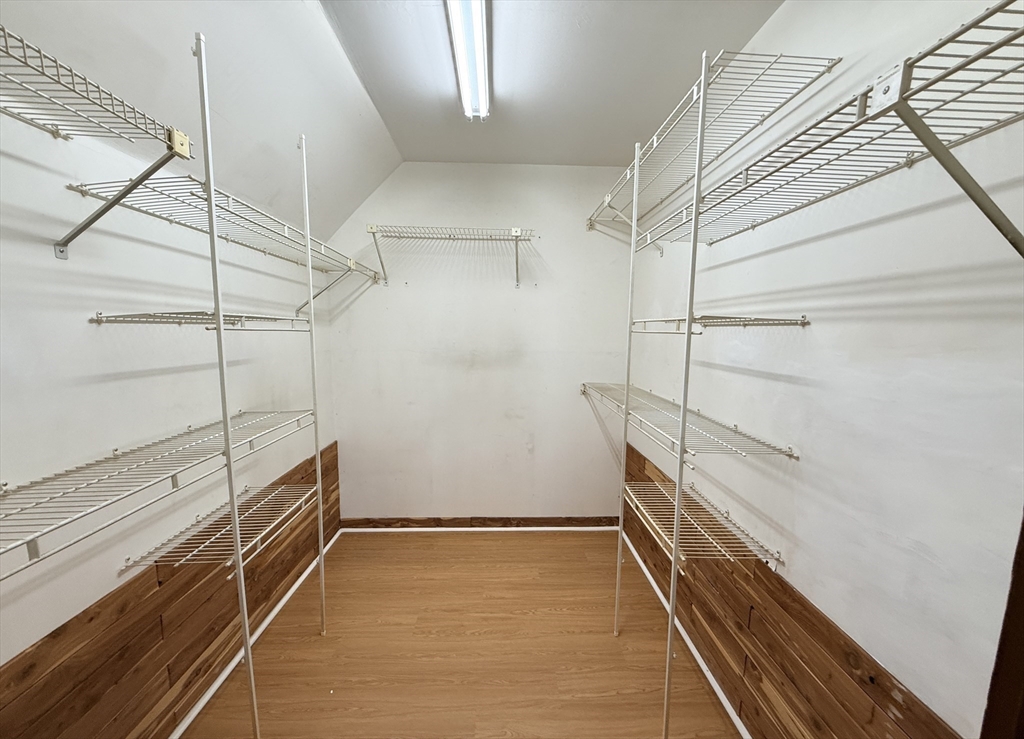 15 Belvoir Road, Unit 2 Milton, MA 02186 - Photo 10 of 13 a view of a room with racks on the wall