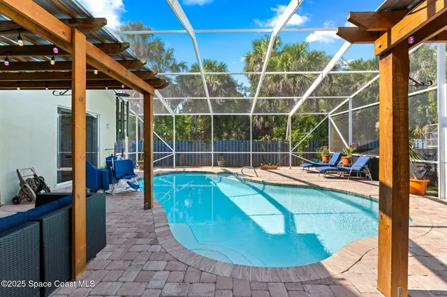 a kitchen with stainless steel appliances kitchen island dining table and chairs