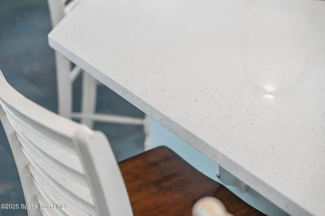 an aerial view of a house with a yard and lake view