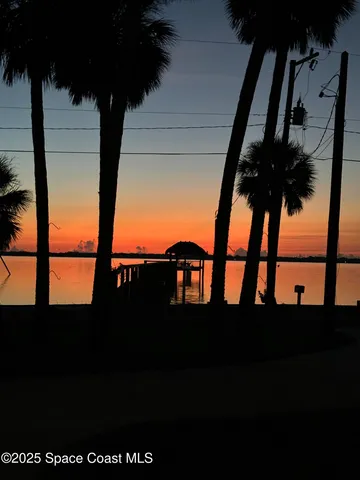 a view of a backyard with sitting area