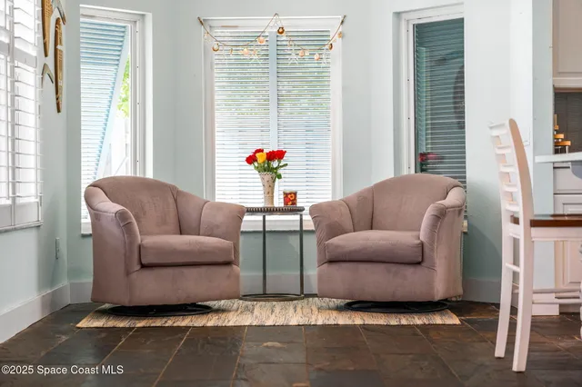 a large kitchen with stainless steel appliances kitchen island granite countertop a refrigerator and a stove