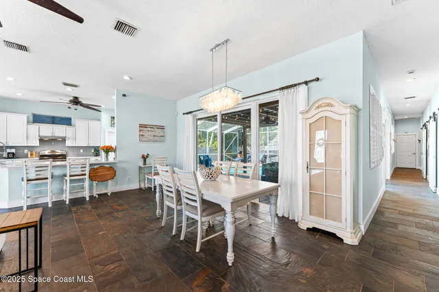 a bathroom with a bathtub sink and mirror