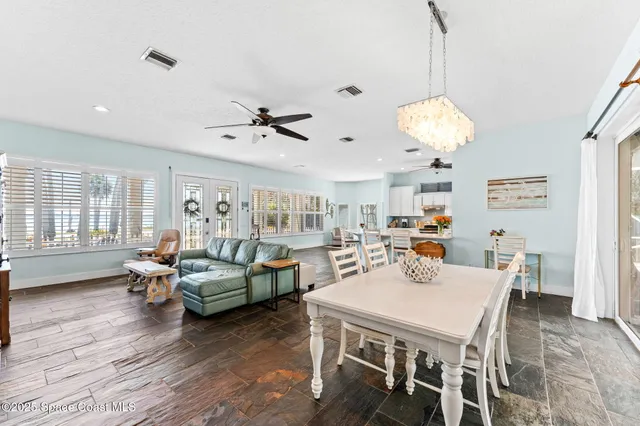 a bathroom with a granite countertop sink a toilet and a mirror