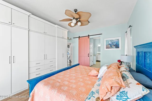 a view of a house with a potted plant and a large window