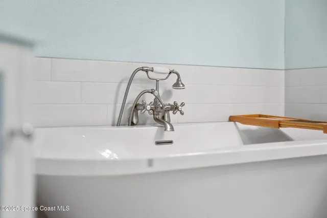 a view of a house with a backyard porch and sitting area