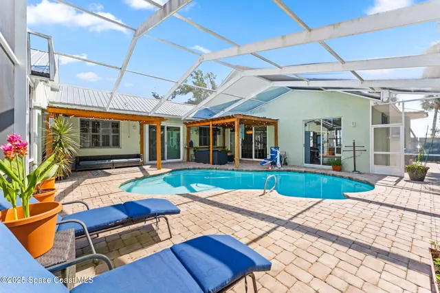 a living room with fireplace furniture and a table