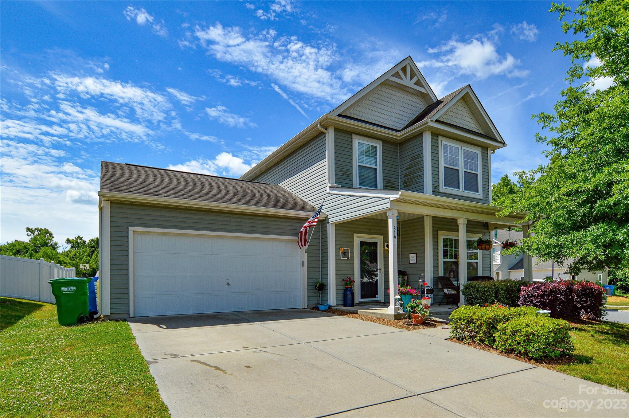 8191 Thornton Street Locust, NC 28097 - Photo 1 of 44 a front view of a house with garden