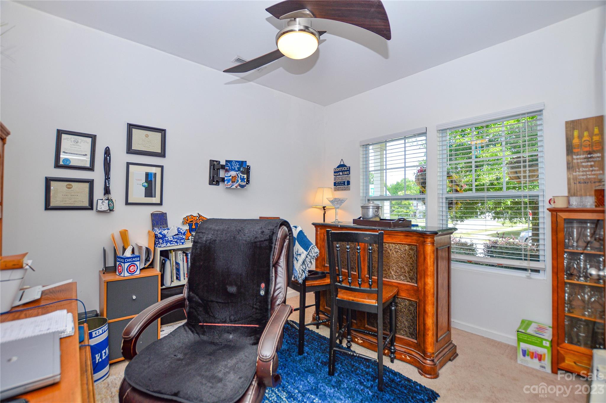 8191 Thornton Street Locust, NC 28097 - Photo 12 of 44 a view of a workspace with furniture and a window