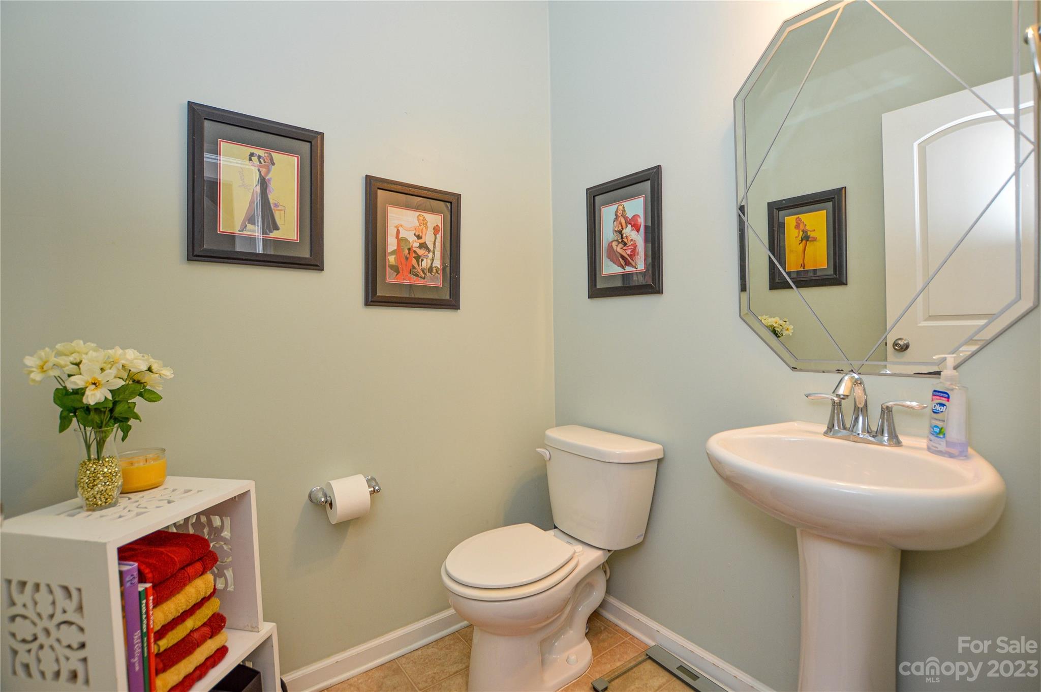 8191 Thornton Street Locust, NC 28097 - Photo 15 of 44 a bathroom with a toilet sink and mirror