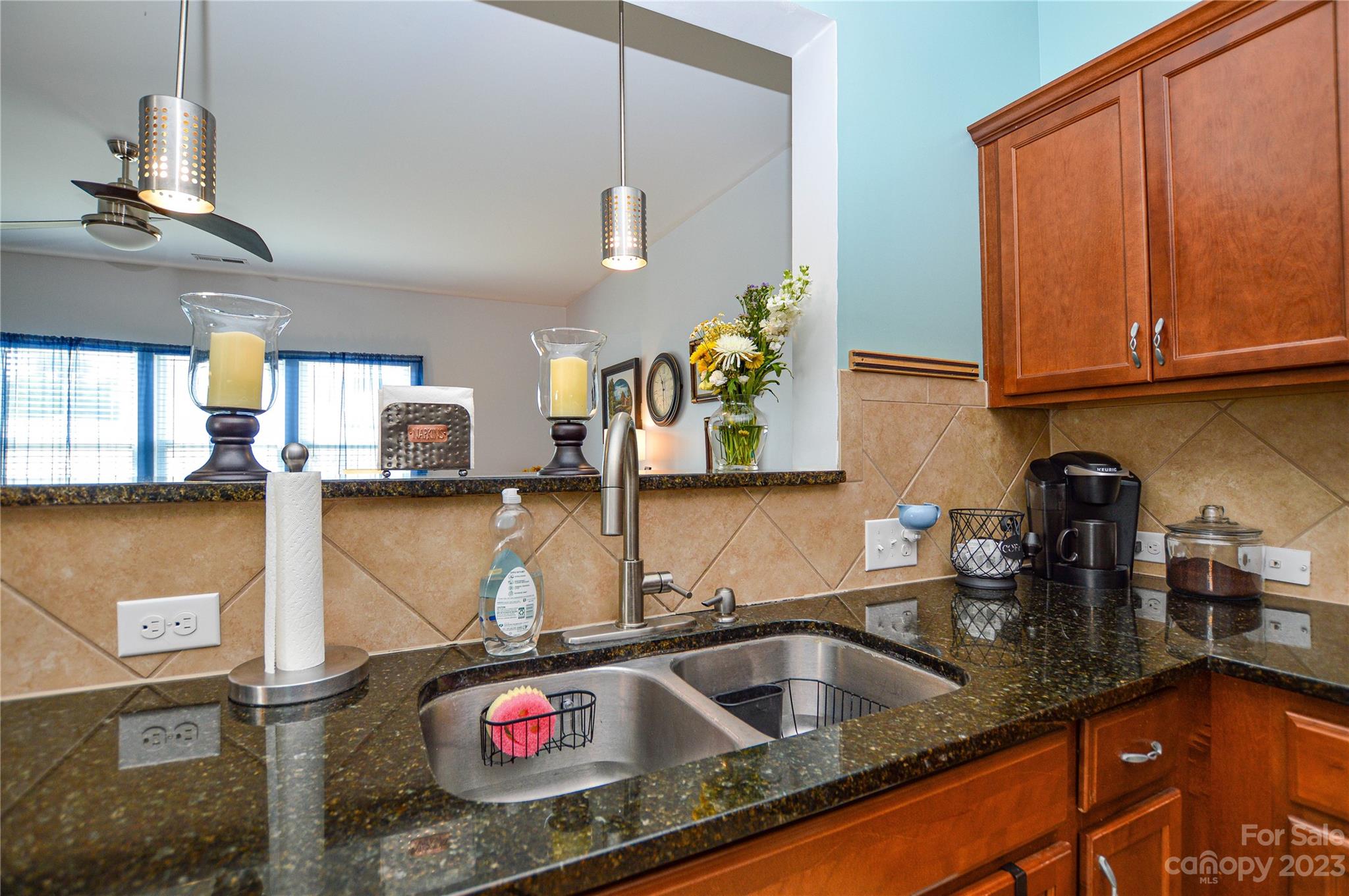 8191 Thornton Street Locust, NC 28097 - Photo 18 of 44 a kitchen with a sink and a stove top oven
