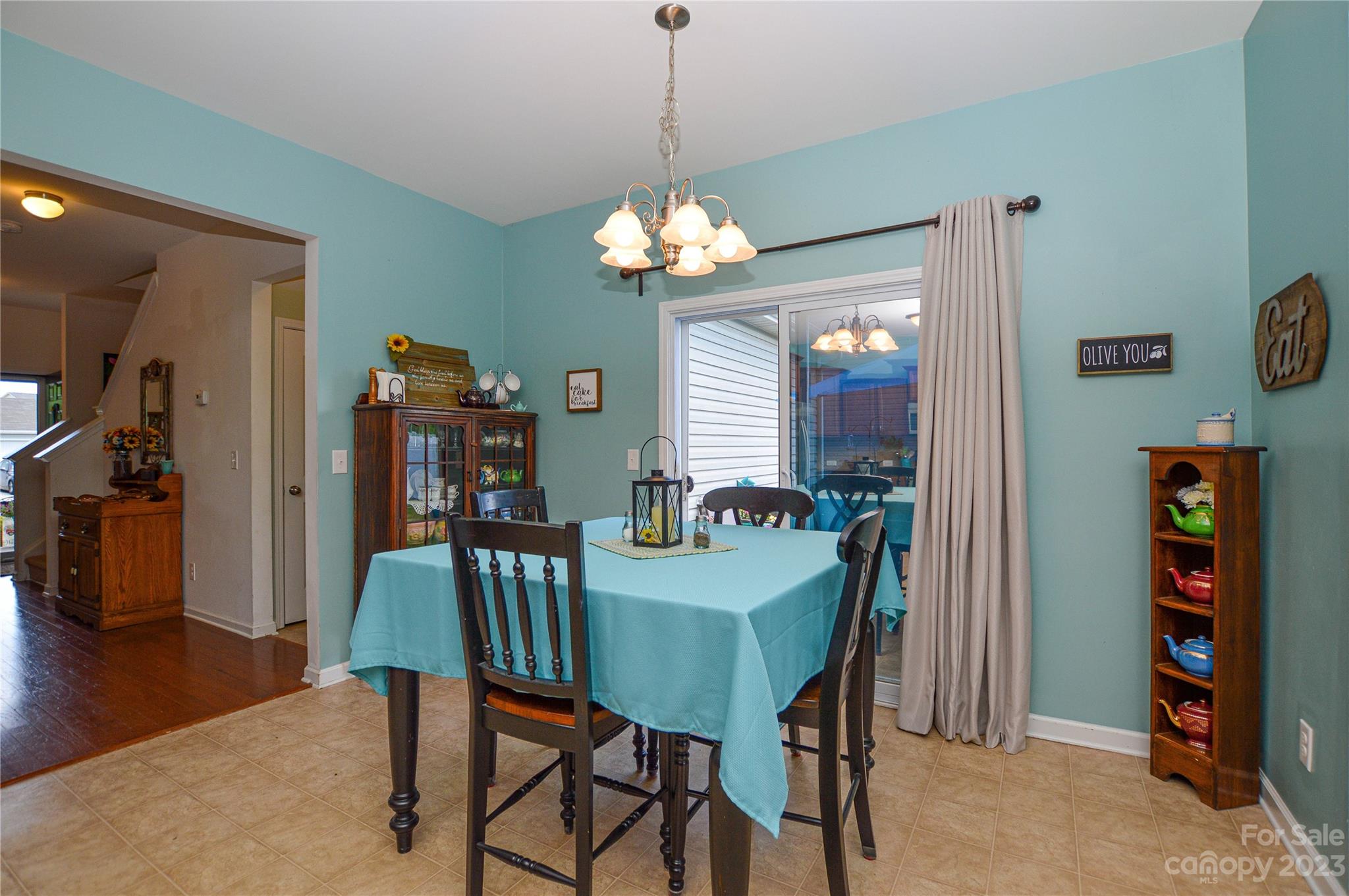 8191 Thornton Street Locust, NC 28097 - Photo 20 of 44 a view of a dining room with furniture and wooden floor