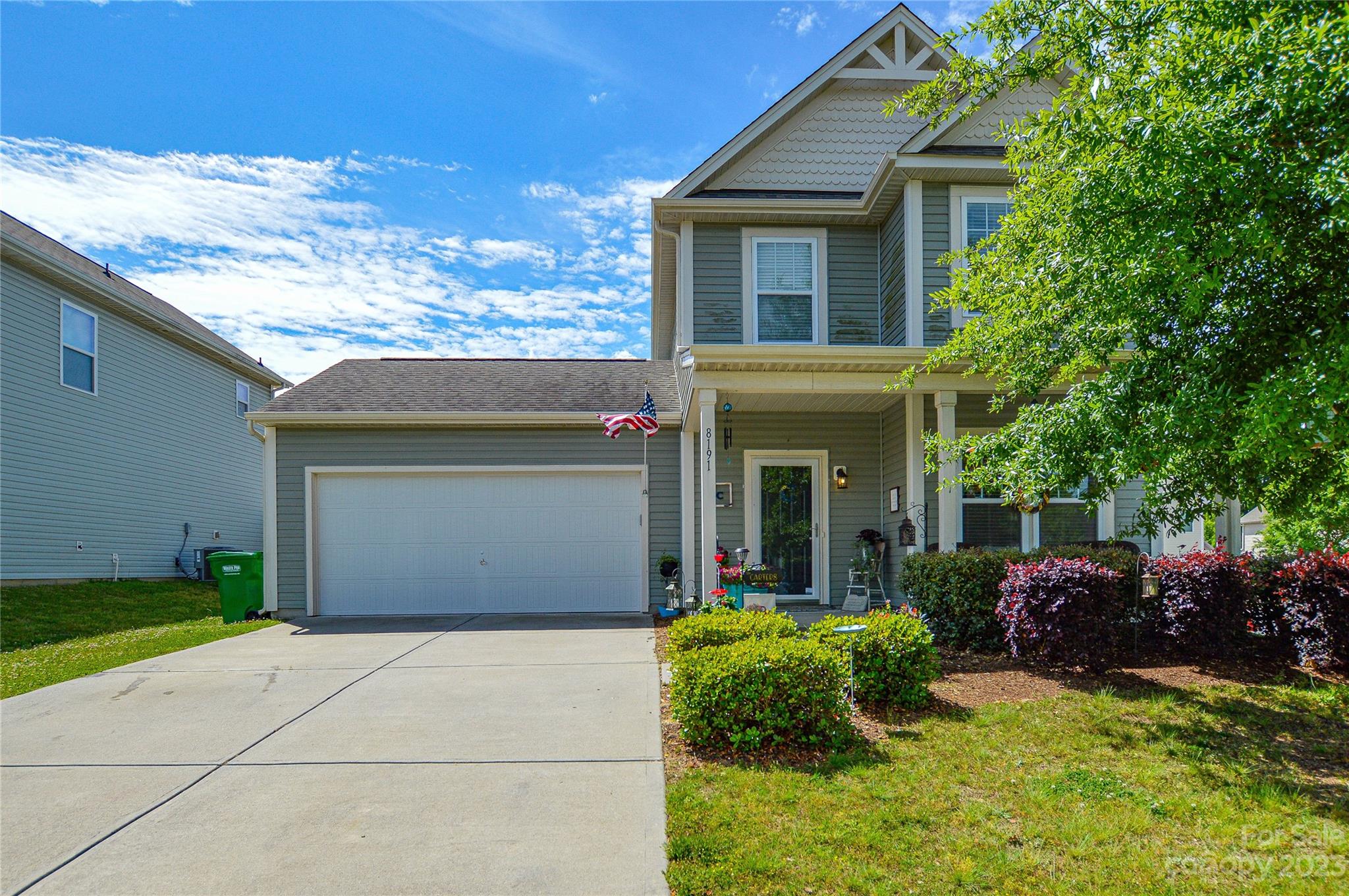 8191 Thornton Street Locust, NC 28097 - Photo 2 of 44 a front view of a house with garden