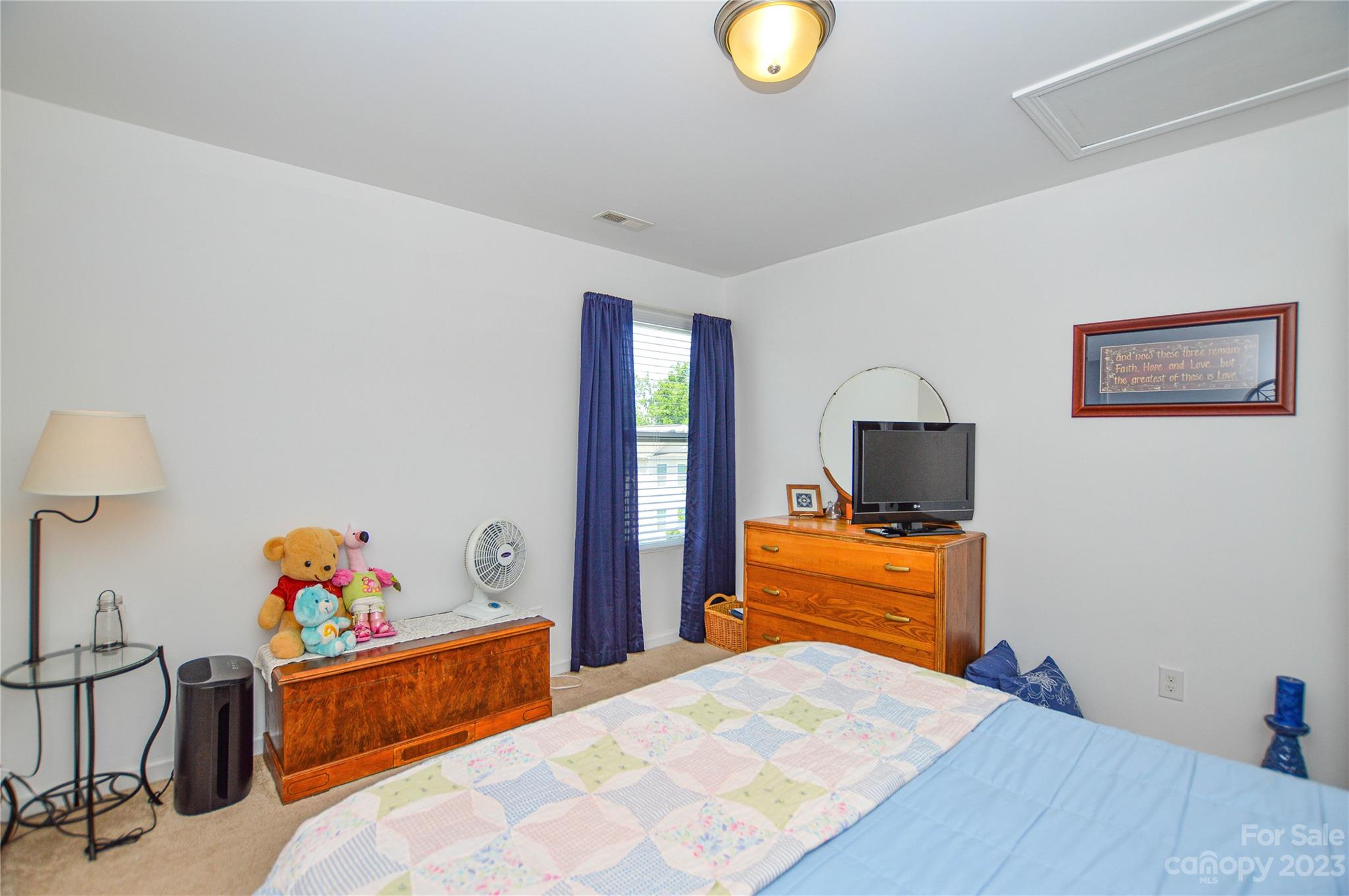 8191 Thornton Street Locust, NC 28097 - Photo 31 of 44 a bedroom with a bed and wooden floor