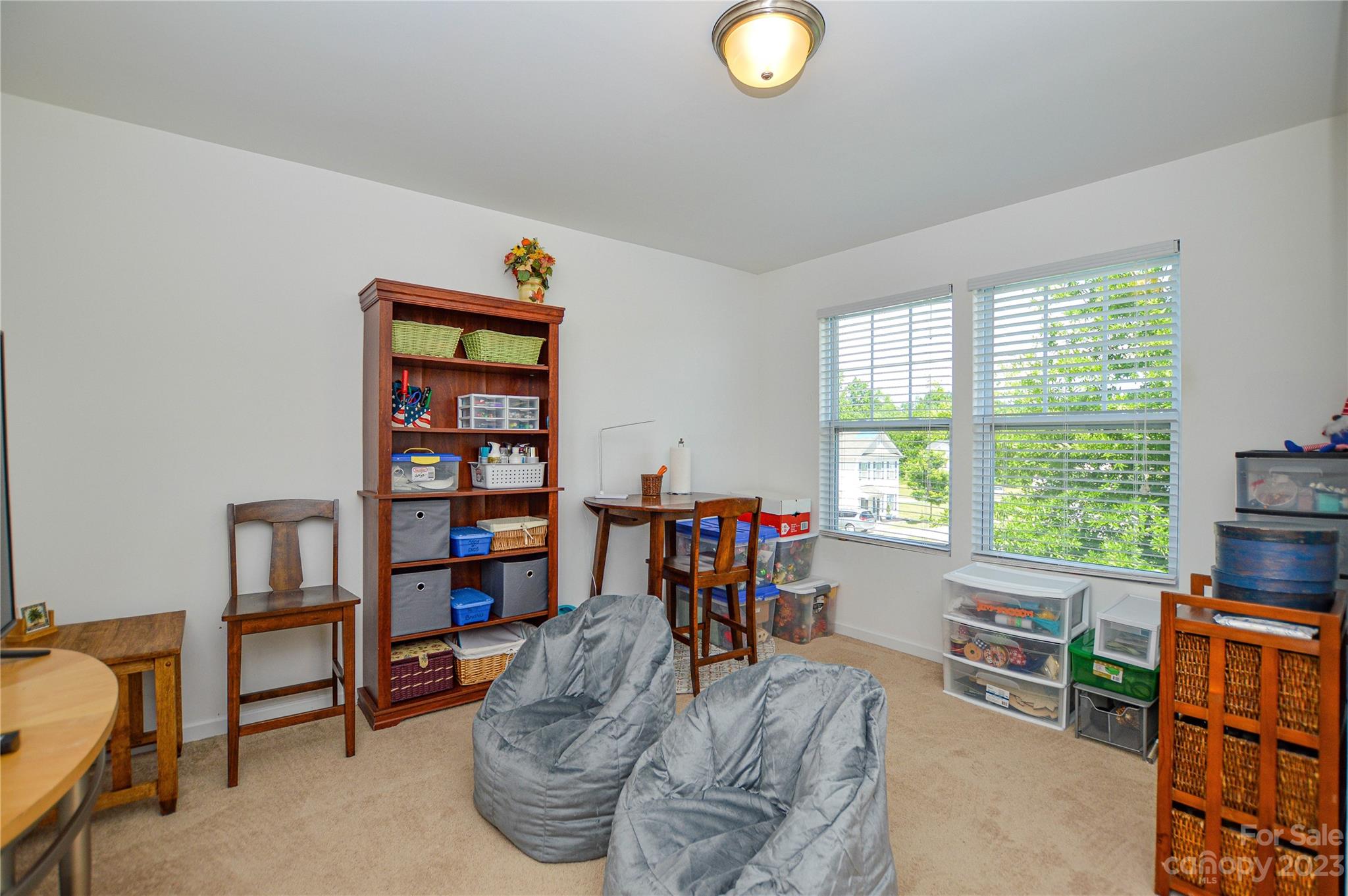 8191 Thornton Street Locust, NC 28097 - Photo 32 of 44 a living room with furniture and a window