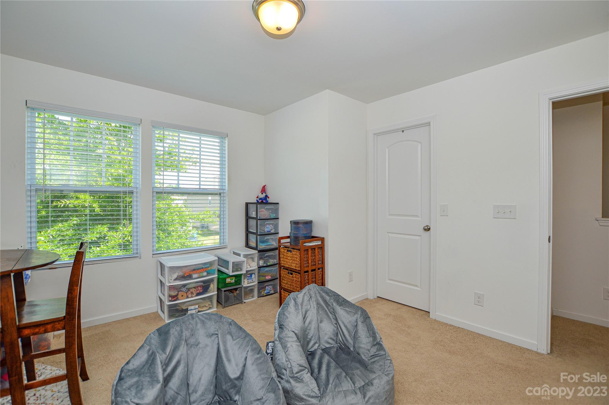 8191 Thornton Street Locust, NC 28097 - Photo 33 of 44 a bed room with furniture and a window