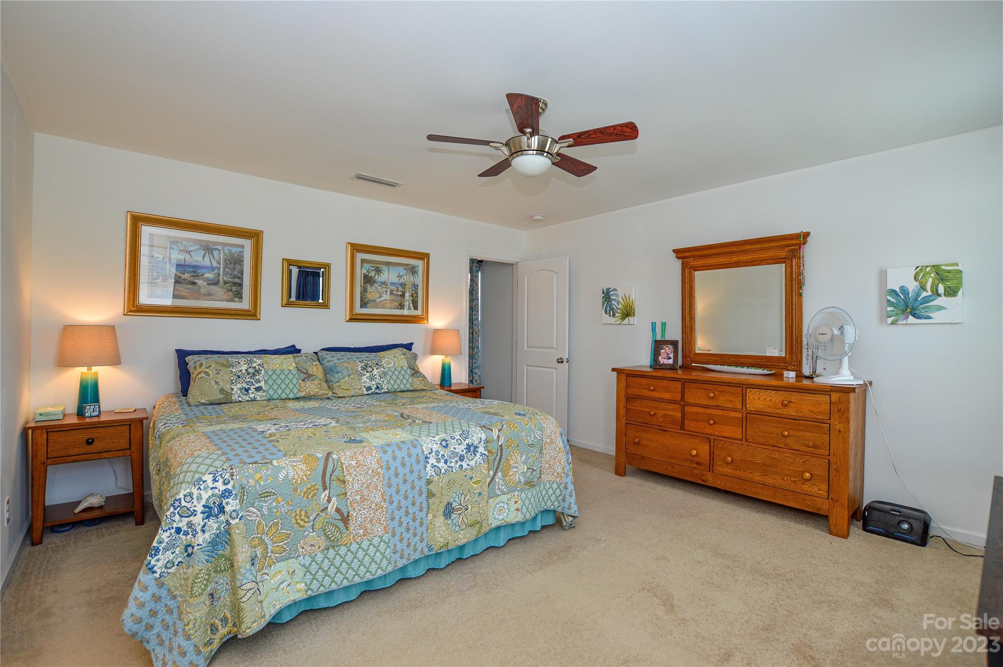 8191 Thornton Street Locust, NC 28097 - Photo 37 of 44 a bedroom with a bed and a dresser in it
