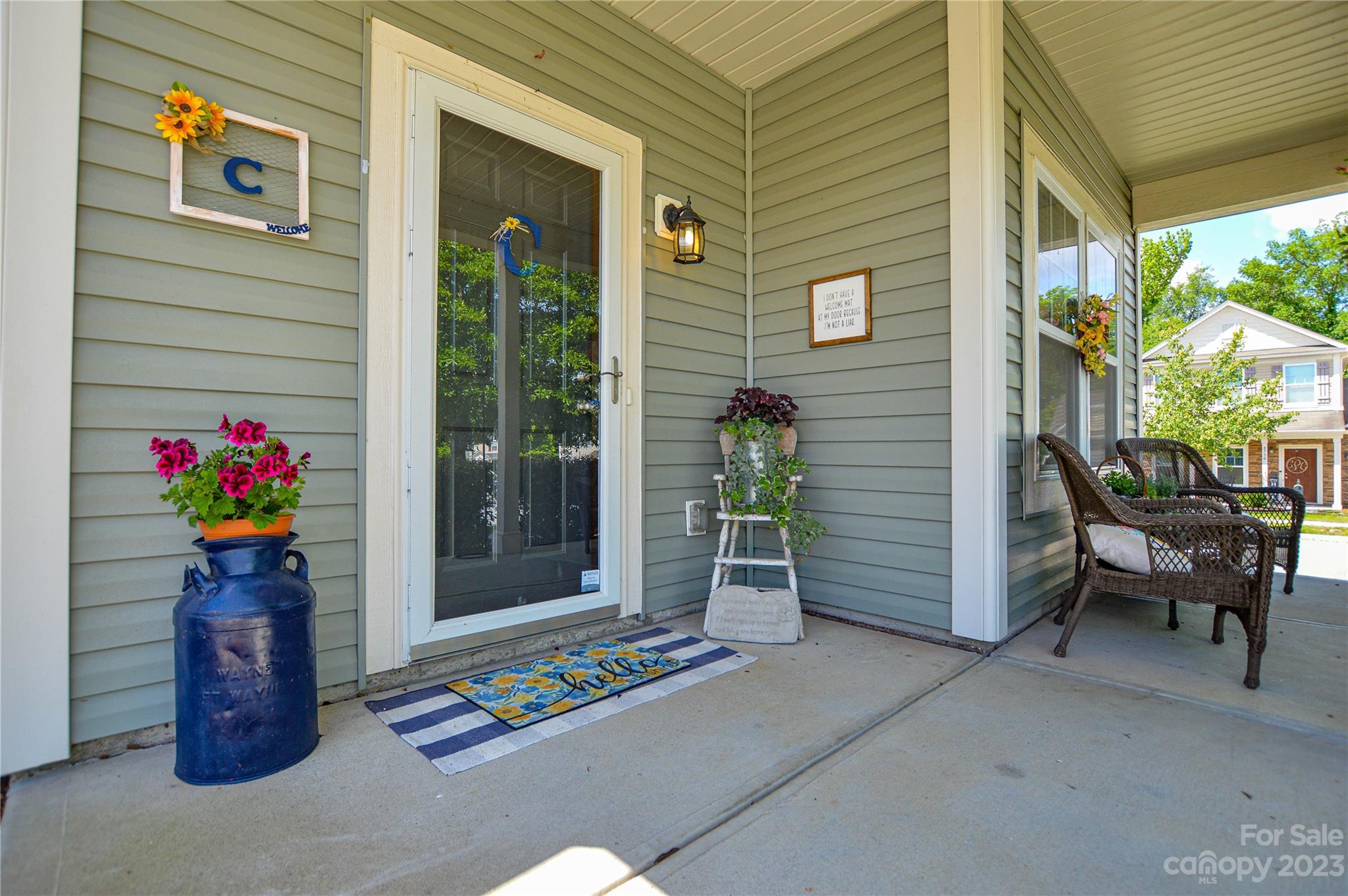 8191 Thornton Street Locust, NC 28097 - Photo 6 of 44 a front view of a house with outdoor seating