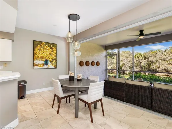 a dining room with furniture and window
