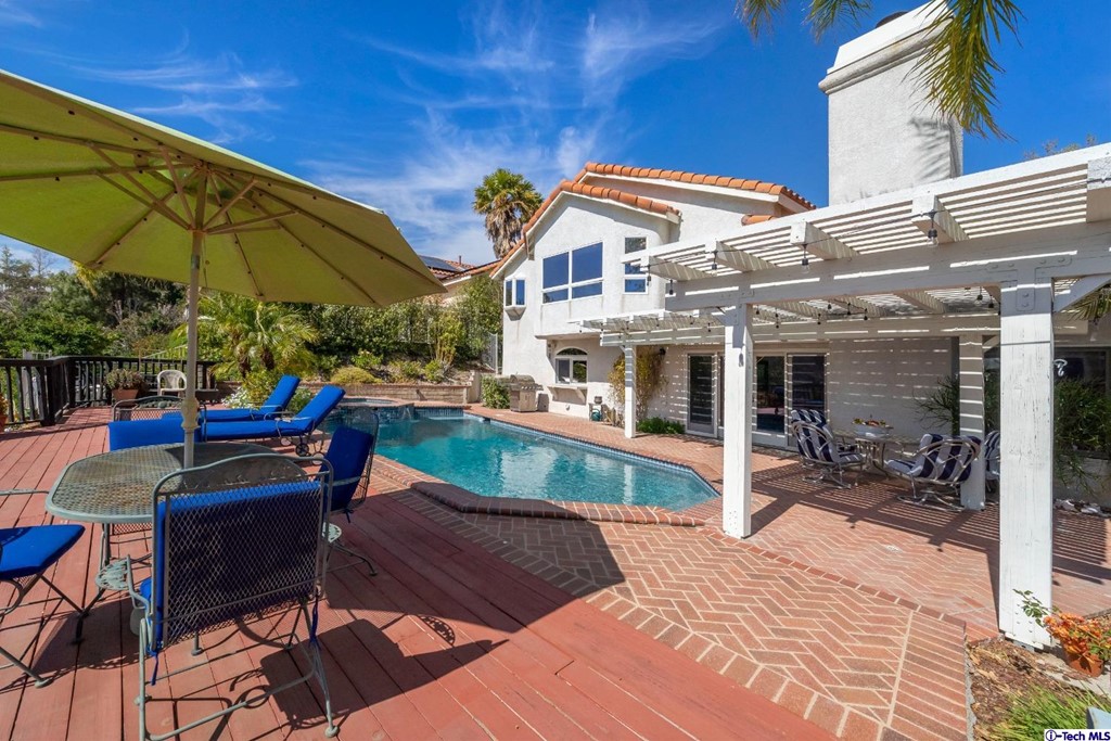 24718 Sagecrest Circle Newhall, CA 91381 - Photo 13 of 36 a view of house with outdoor seating and city view