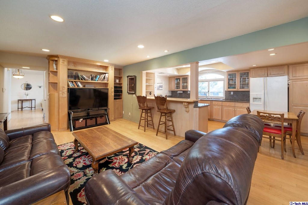 24718 Sagecrest Circle Newhall, CA 91381 - Photo 19 of 36 a living room with furniture and a flat screen tv