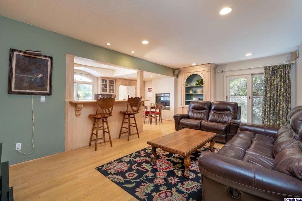 24718 Sagecrest Circle Newhall, CA 91381 - Photo 20 of 36 a living room with furniture a rug and a large window