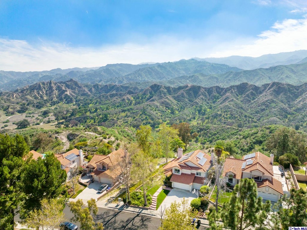 24718 Sagecrest Circle Newhall, CA 91381 - Photo 2 of 36 an aerial view of residential houses and outdoor space