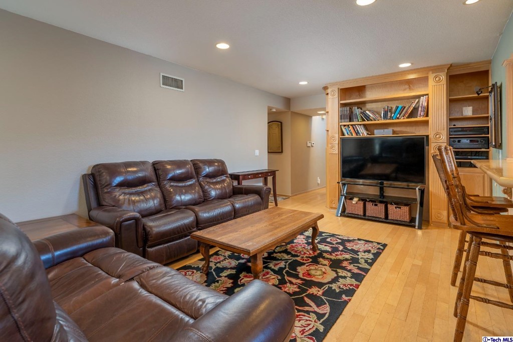 24718 Sagecrest Circle Newhall, CA 91381 - Photo 21 of 36 a living room with furniture and a flat screen tv